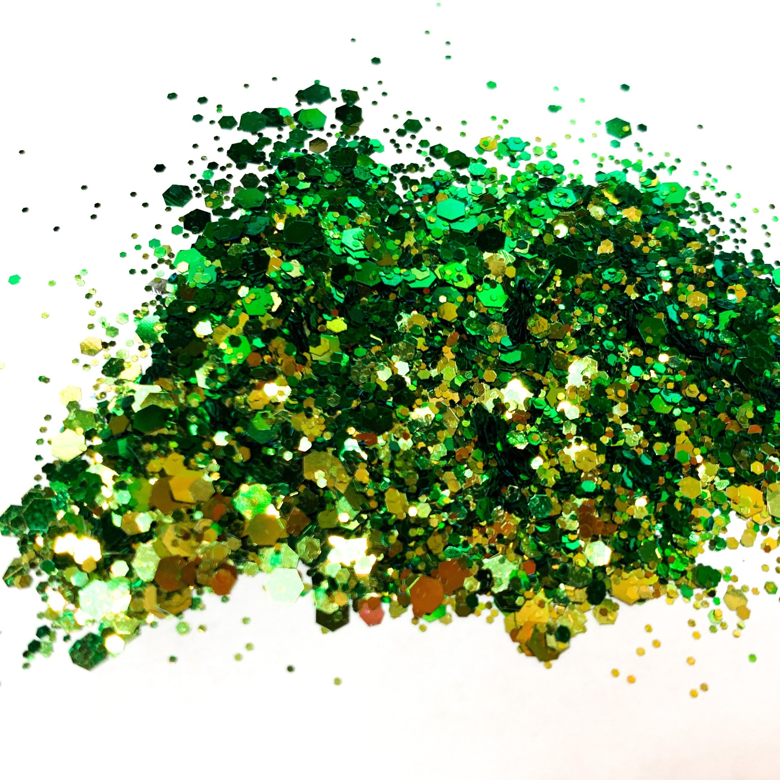 A green/gold chameleon colour shift glitter on a white background.