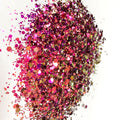 A pink/gold chameleon colour shift  glitter on a white background.