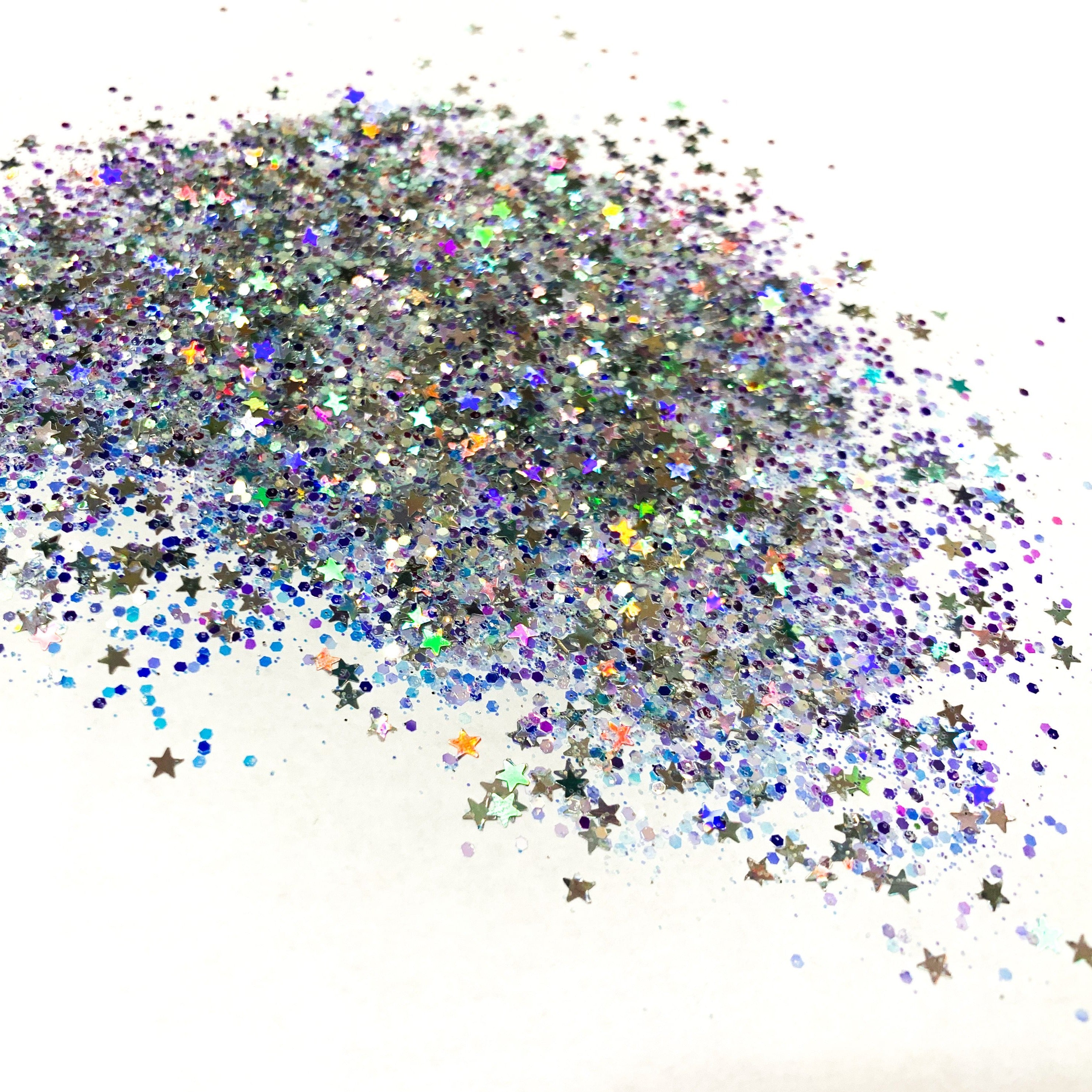 A holographic chunky mix of multicolored glitter with star shapes.