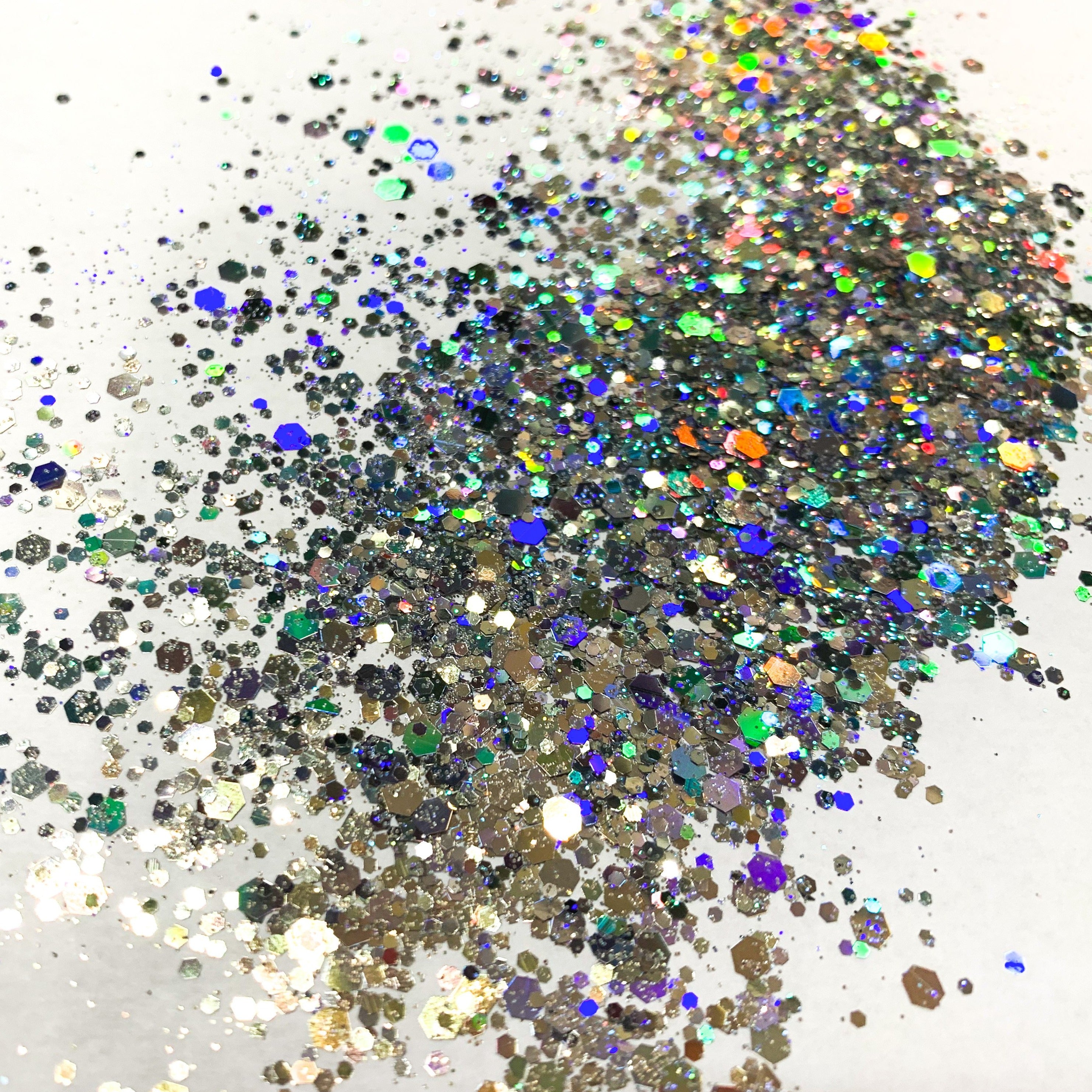 A silver holographic chunky glitter mix on a white background.