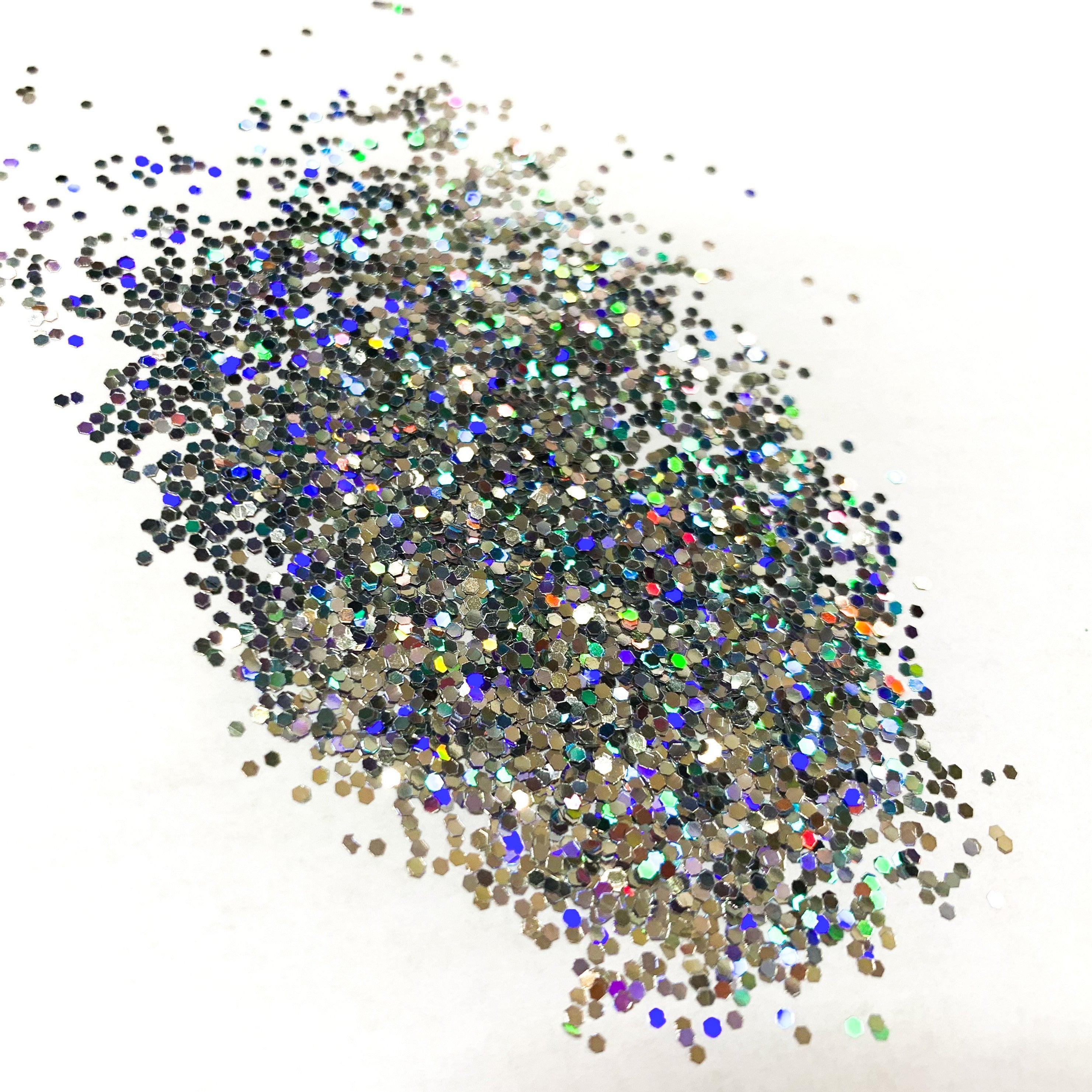 A silver holographic glitter in a medium cut on a white background.