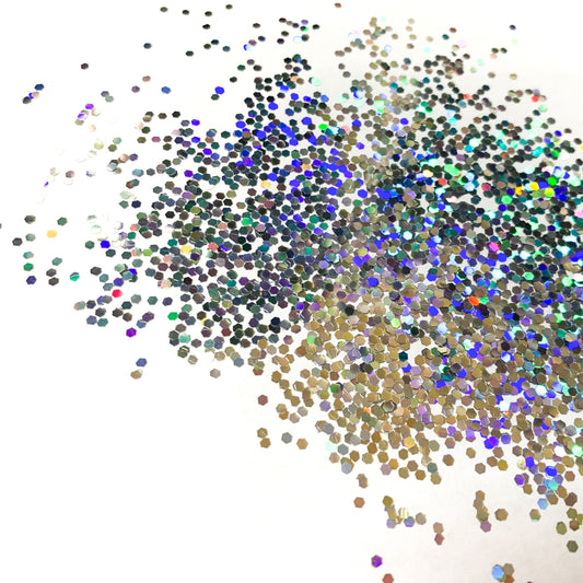 A silver holographic glitter in a large cut on a white background.