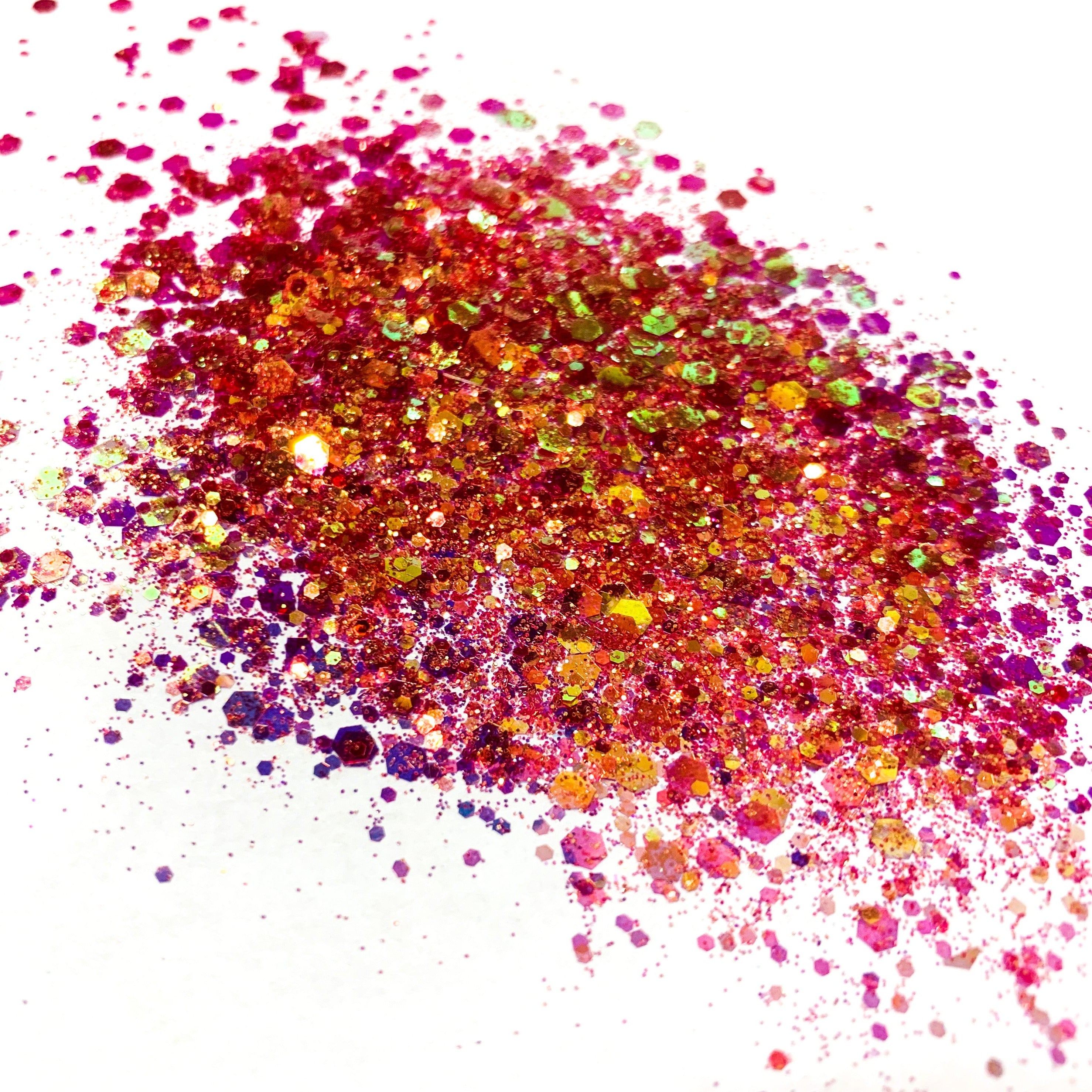 A burnt orange/gold chunky glitter mix on a white background.