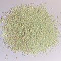 A pile of light green rainbow gradient chunky glitter mix.