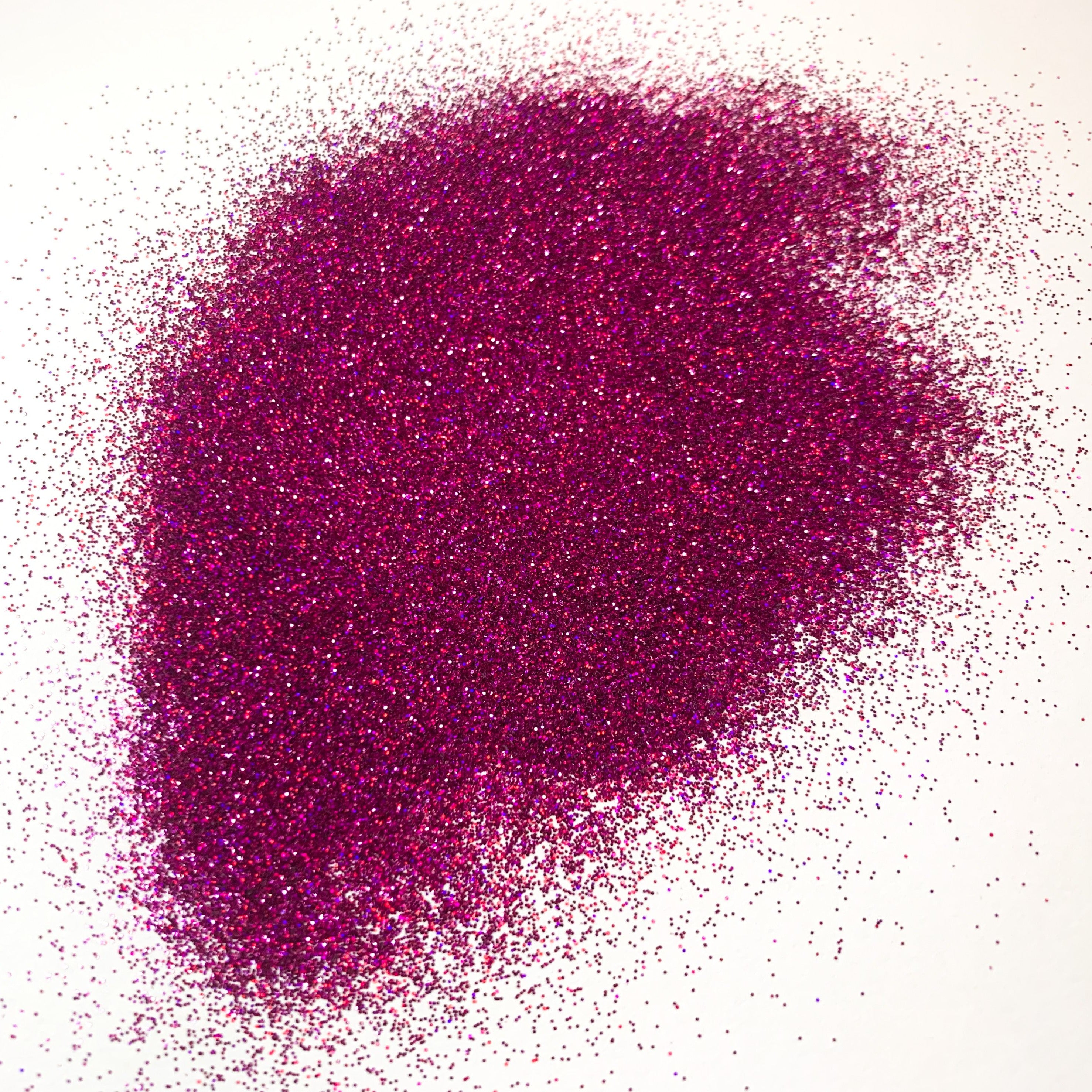 A pile of purple glitter on a white background.
