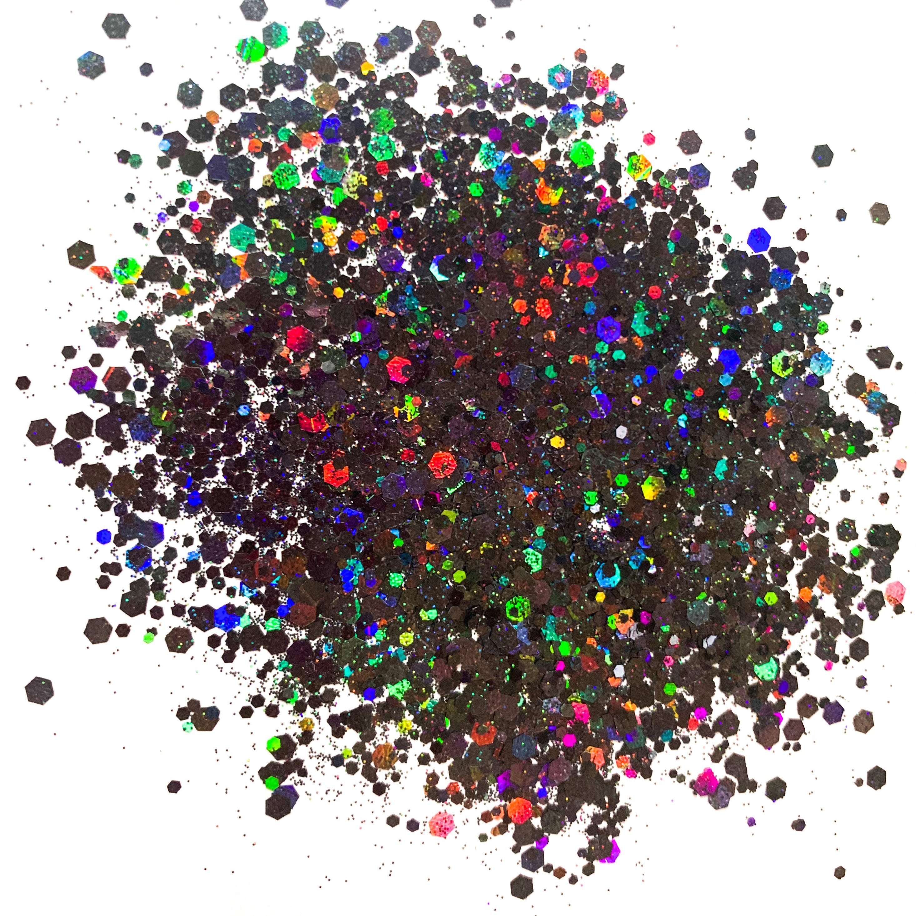 A pile of black holographic chunky glitter mix on a white background