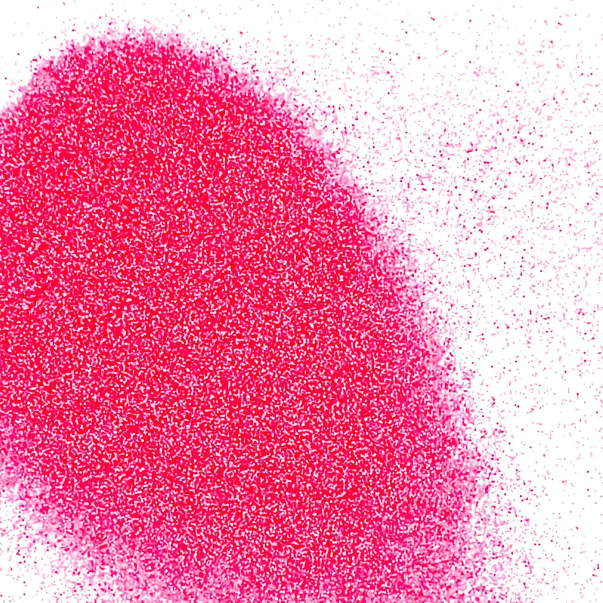 A pile of pink, matte finish polyester glitter.