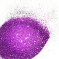 A close-up image of lilac purple colored polyester glitter spread on a surface.