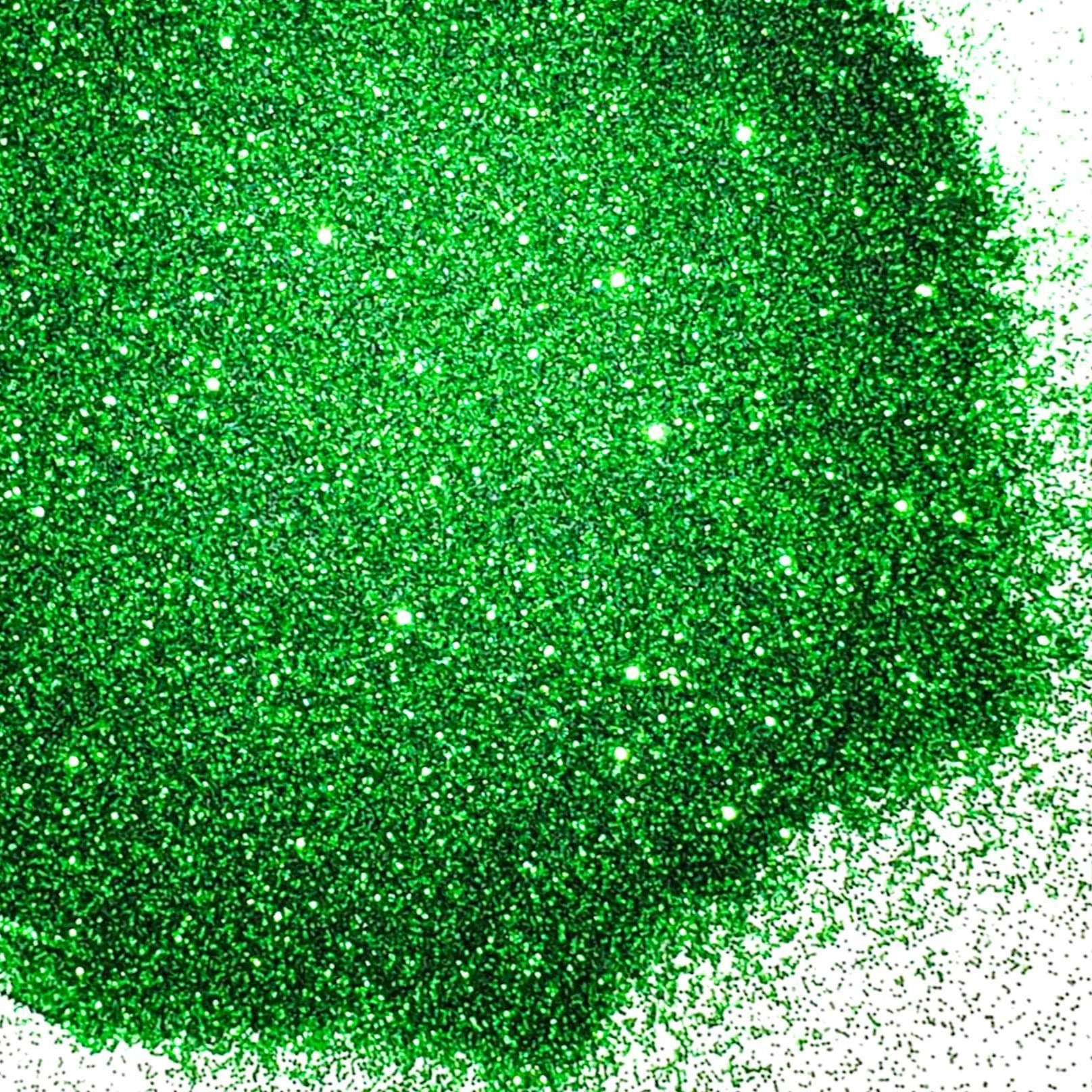 A close-up image of green metallic glitter spread on a surface.
