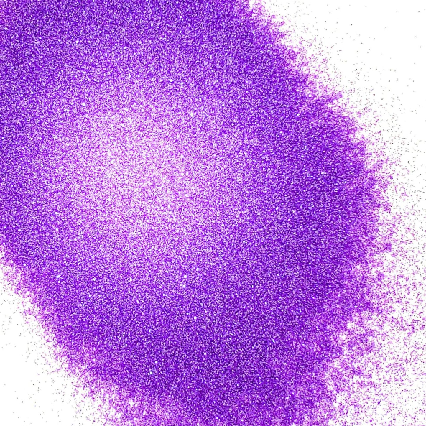 A pile of purple glitter, in extra fine on a white background.
