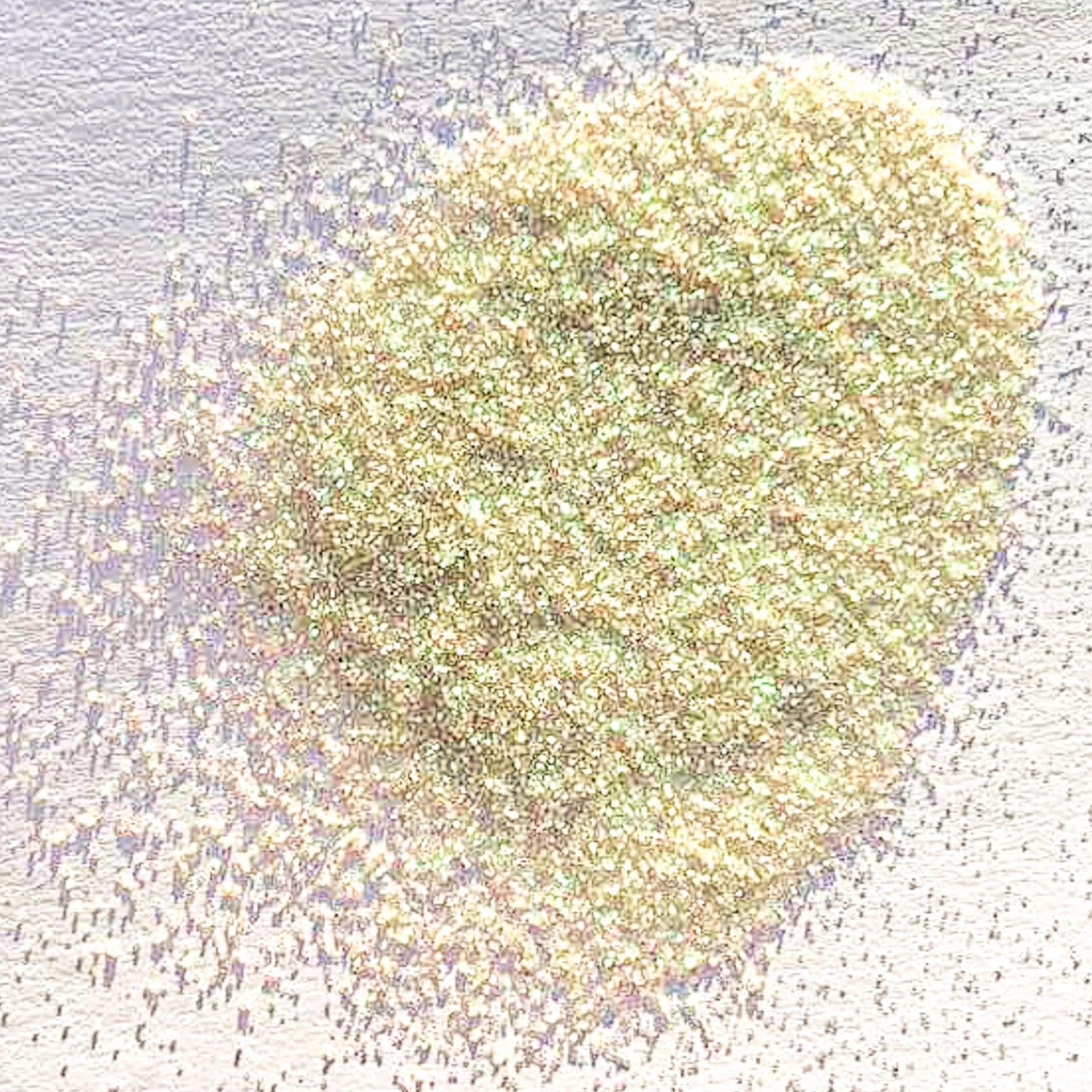 A light green extra fine glitter on a white background.