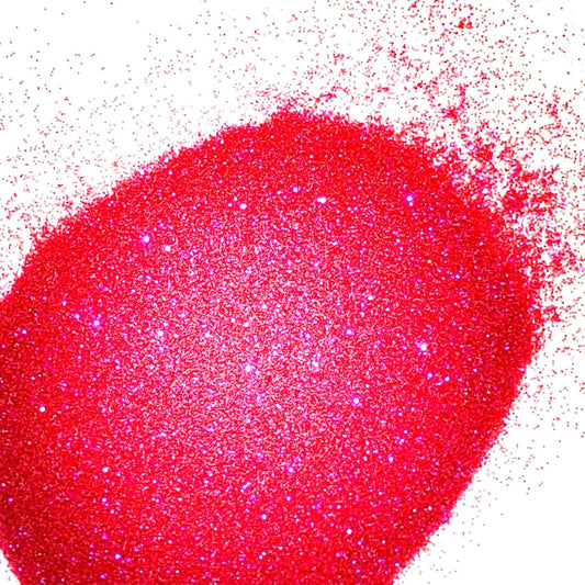 A pile of dark pink, extra fine, iridescent glitter, scattered on a surface.