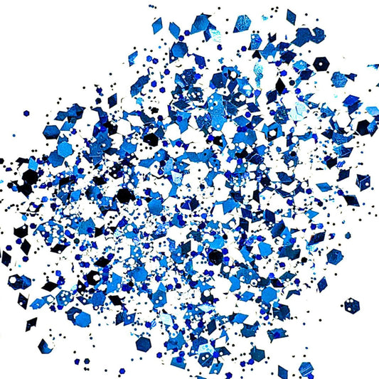 A mix of blue and white glitter pieces scattered on a white background.