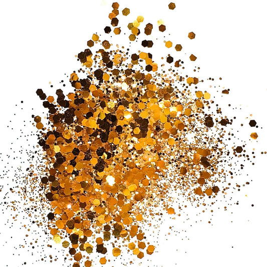 A cluster of bronze and copper colored round glitter pieces scattered on a white background.