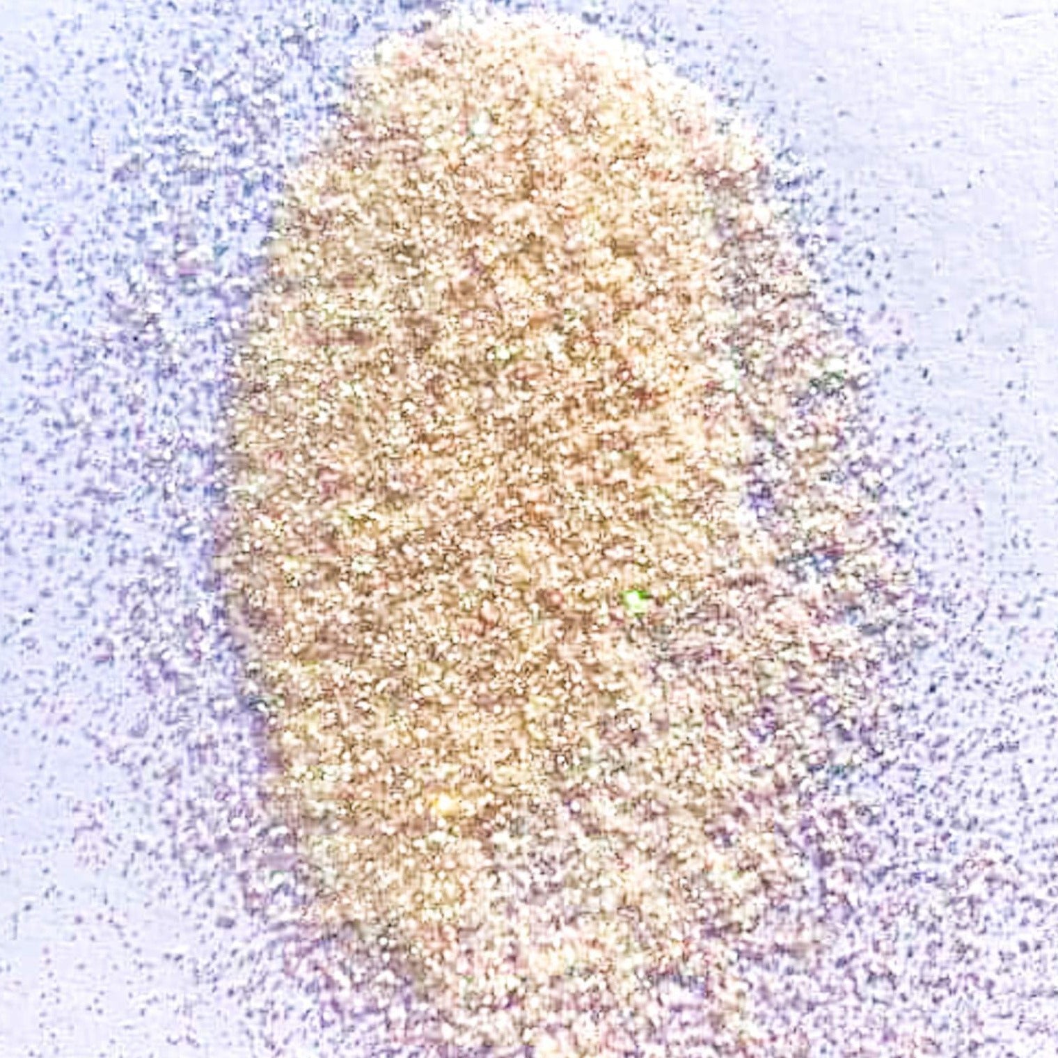 A light orange extra fine glitter on a white background.