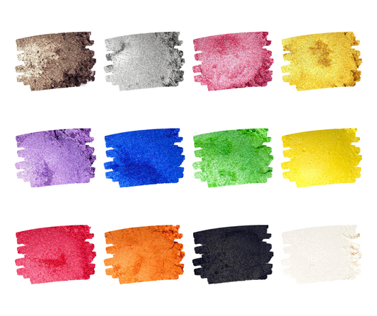 An assortment of colored mica powders displayed in individual jars, ranging from brown, gray, pink, purple, blue, green, yellow, red, orange, black, and white.