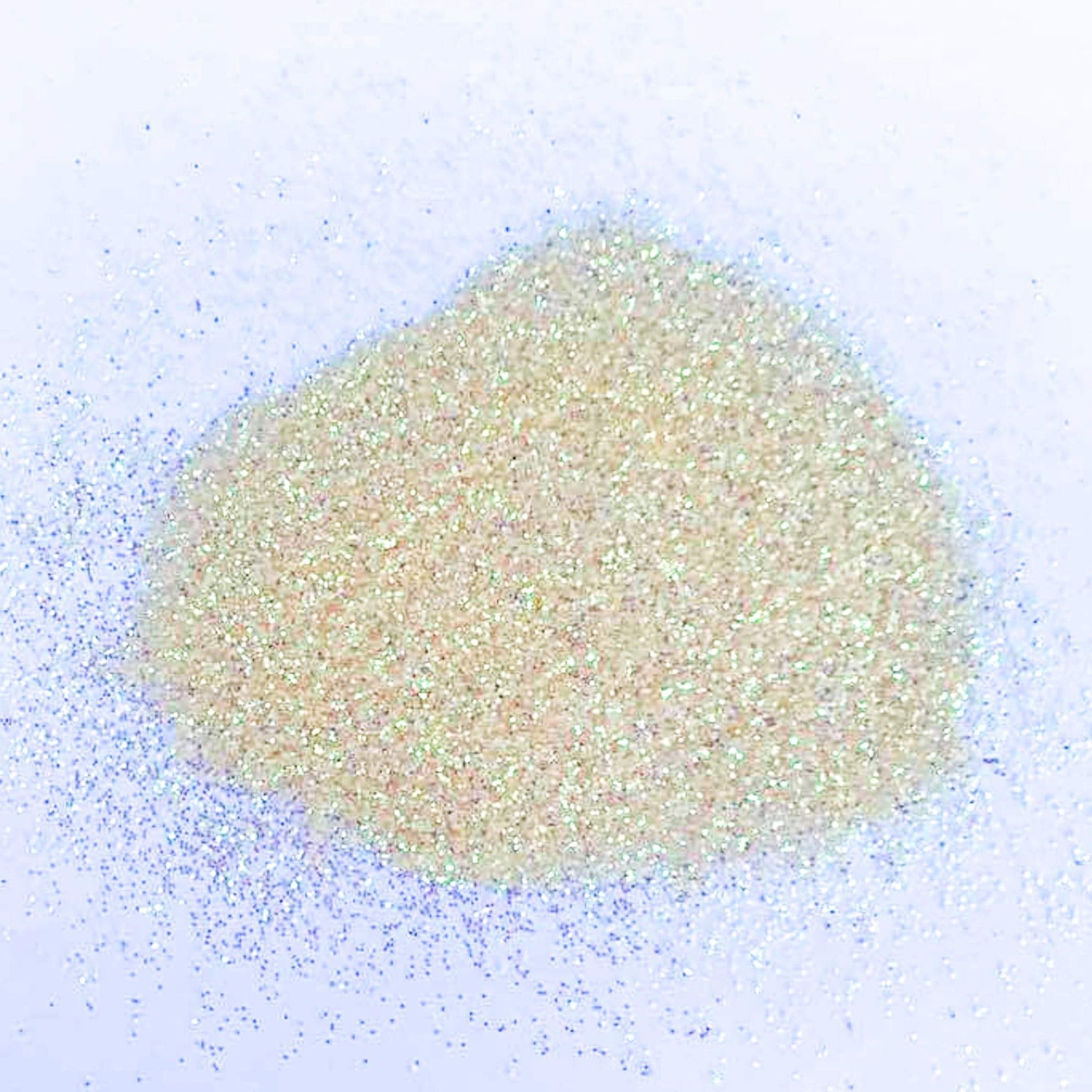 A light yellow extra fine glitter on a white background.