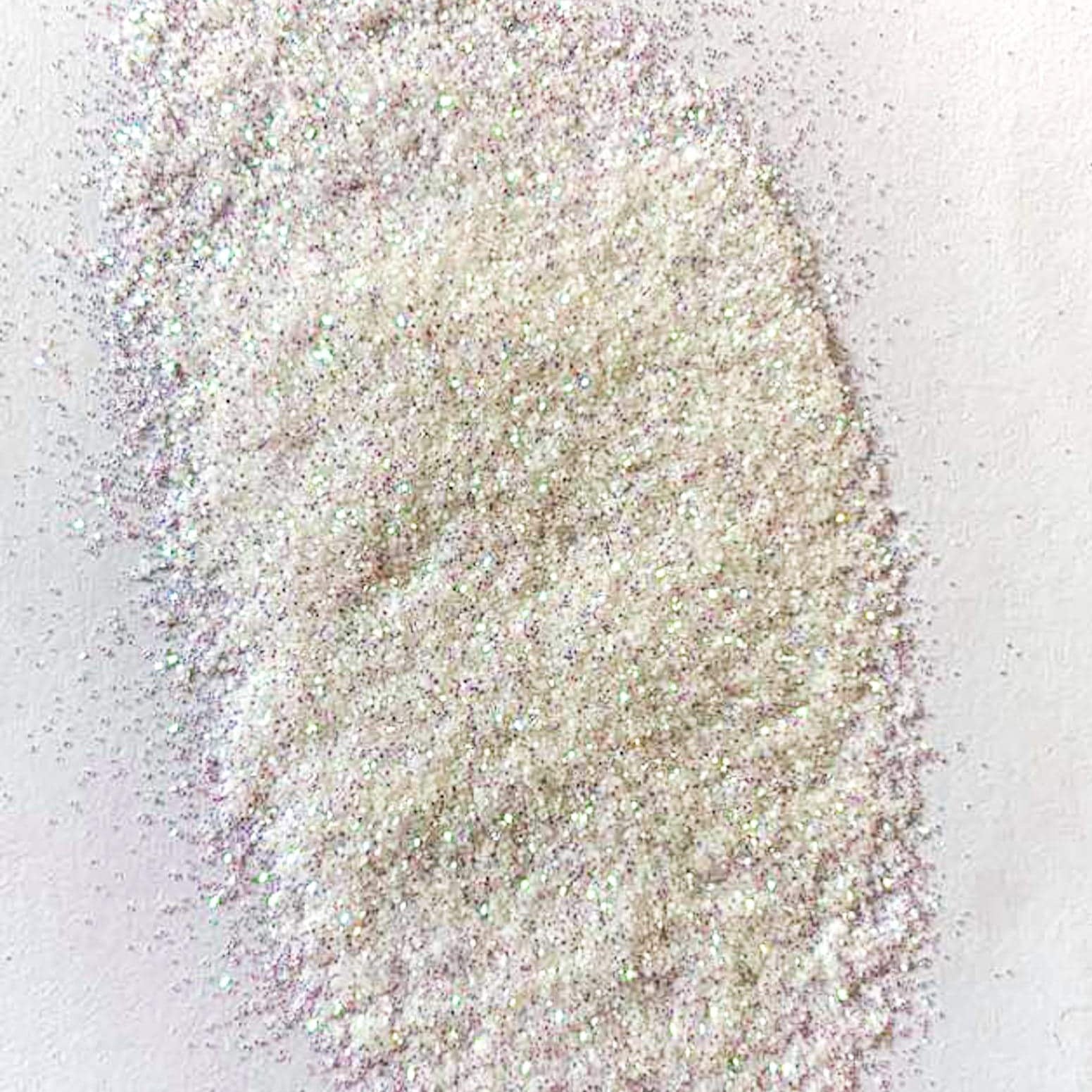 A white extra fine glitter on a white background.