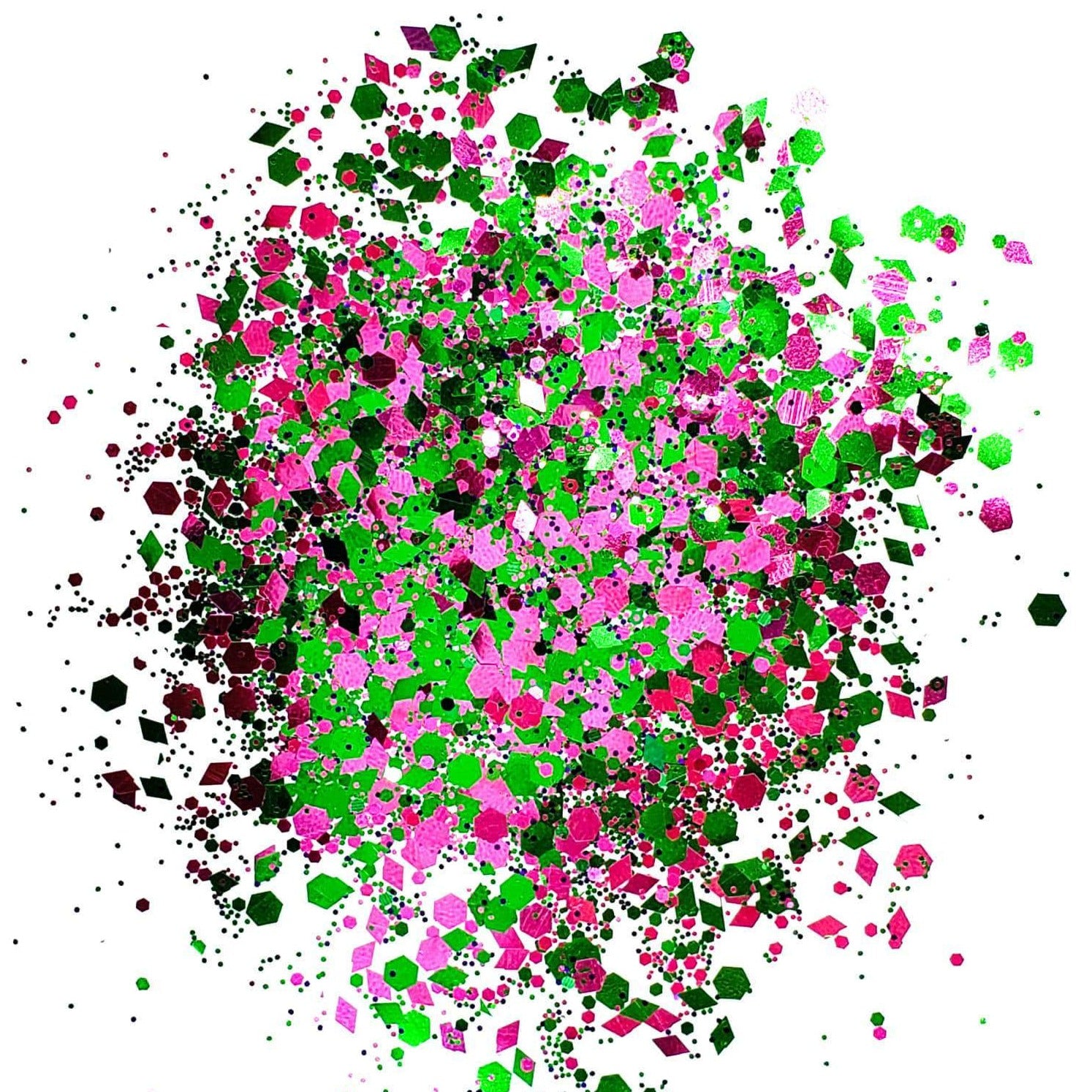 A colorful mix of pink and green chunky glitter spread out on a surface.