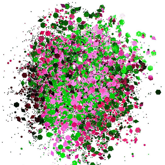A colorful mix of pink and green chunky glitter spread out on a surface.